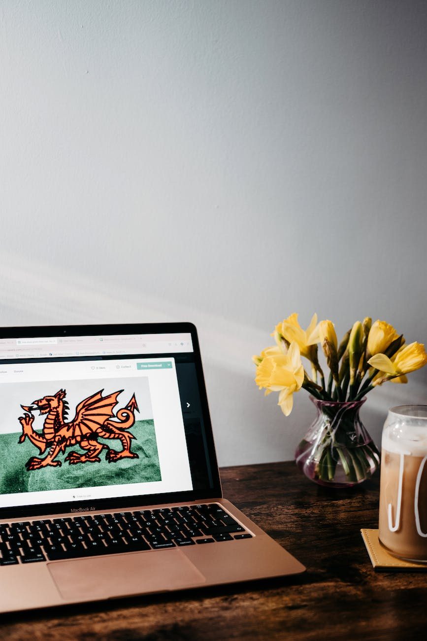 laptop on the table with heraldic symbol of wales